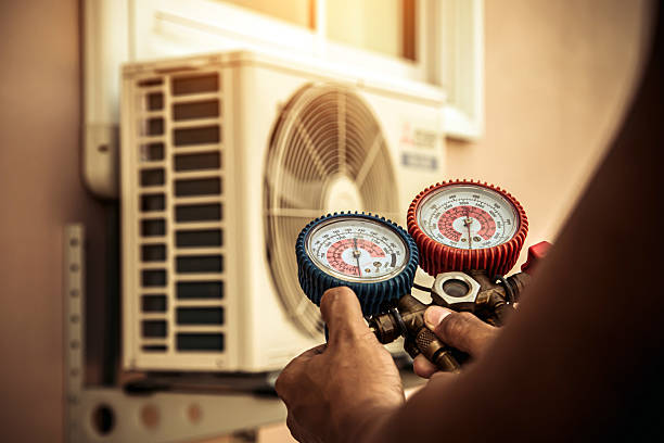 Professional Air Conditioning Service technician working in Washington Mills, NY